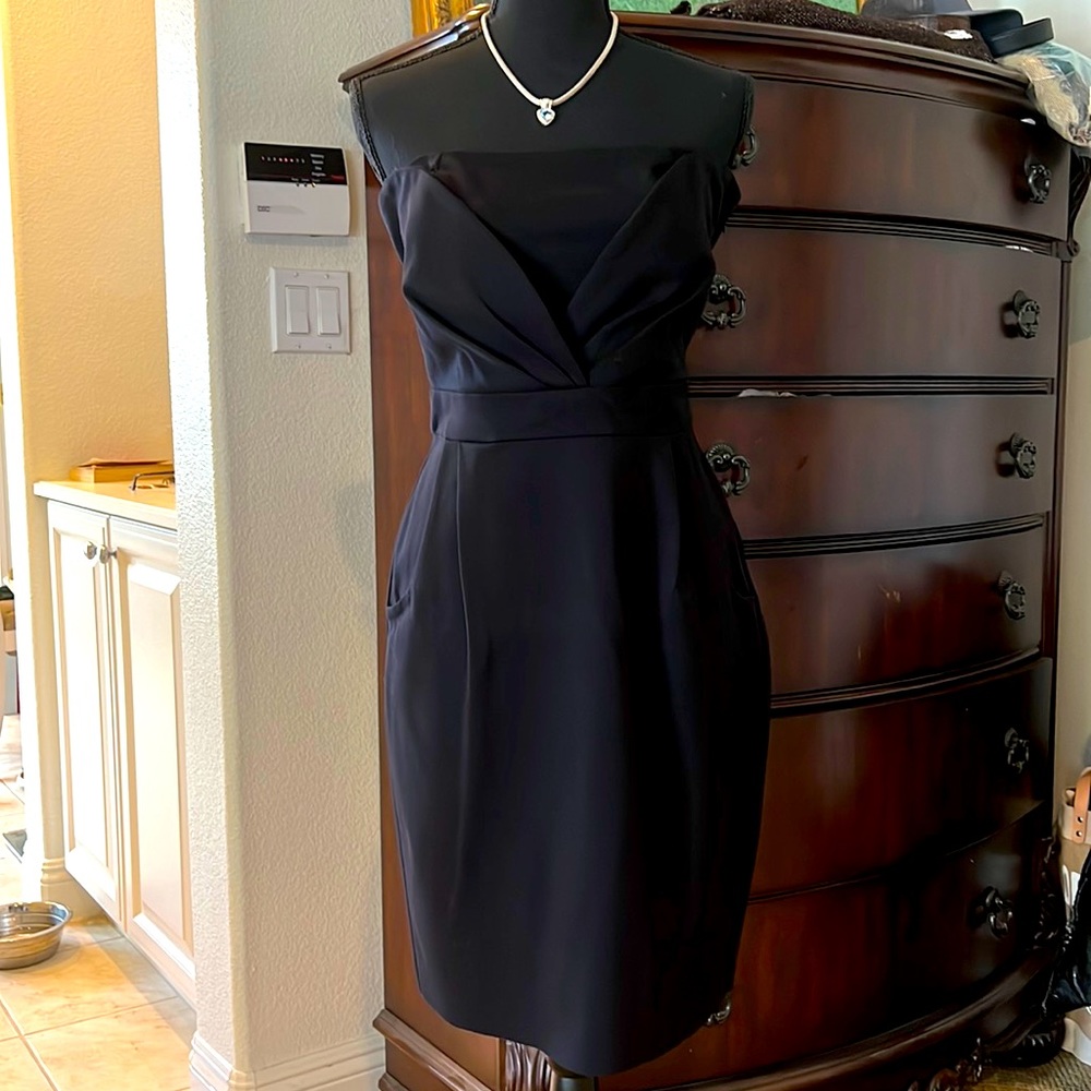 Little black strapless dress. Detailing at the top. Has pockets!!!